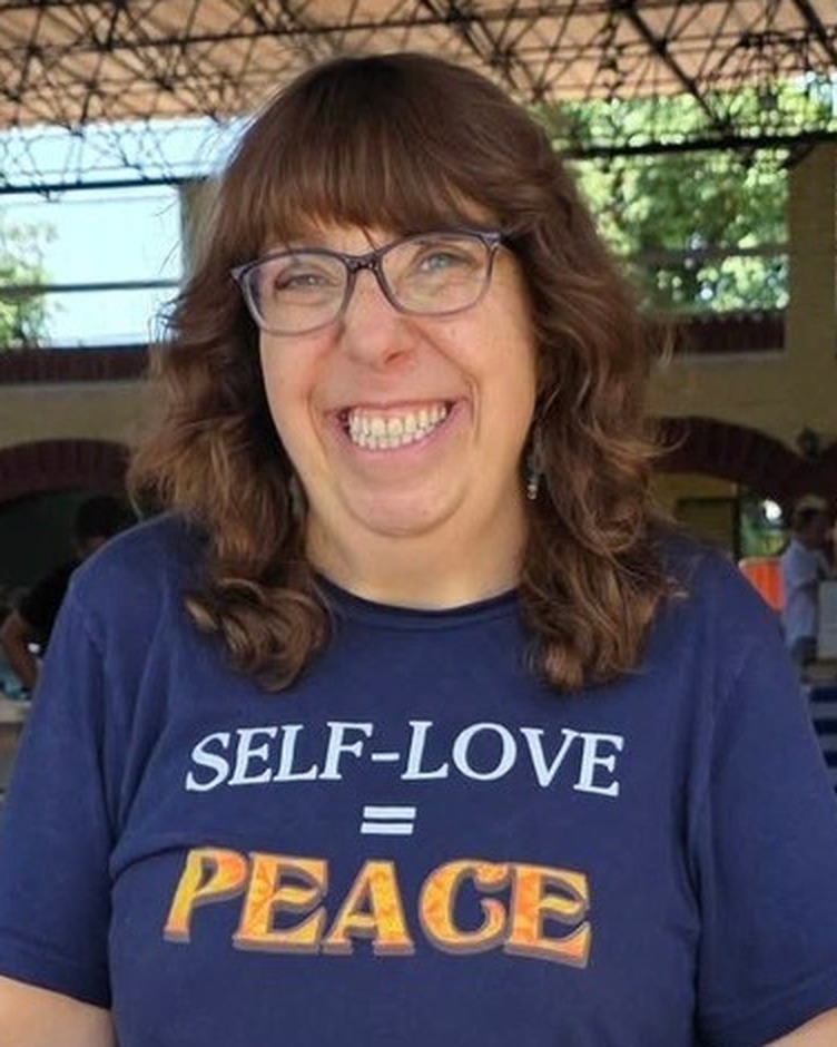 Sherry smiling at an outdoor market in Mexico